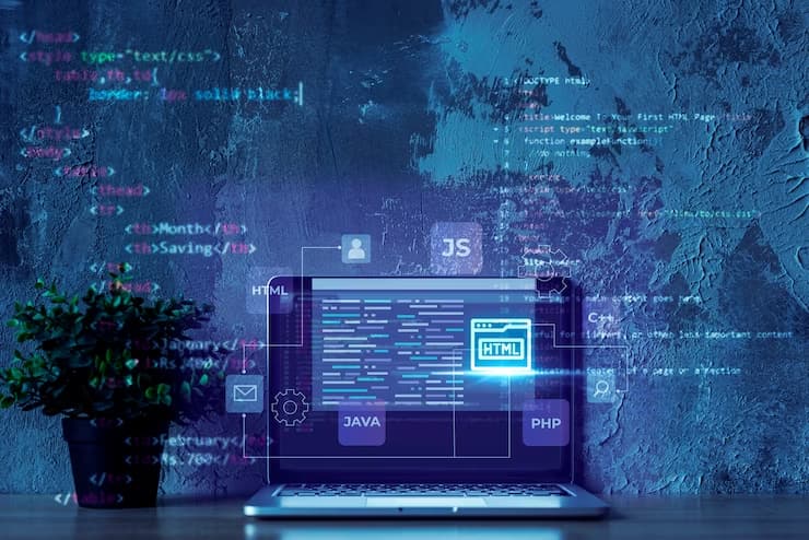 HTML Code on Laptop and Blue Background