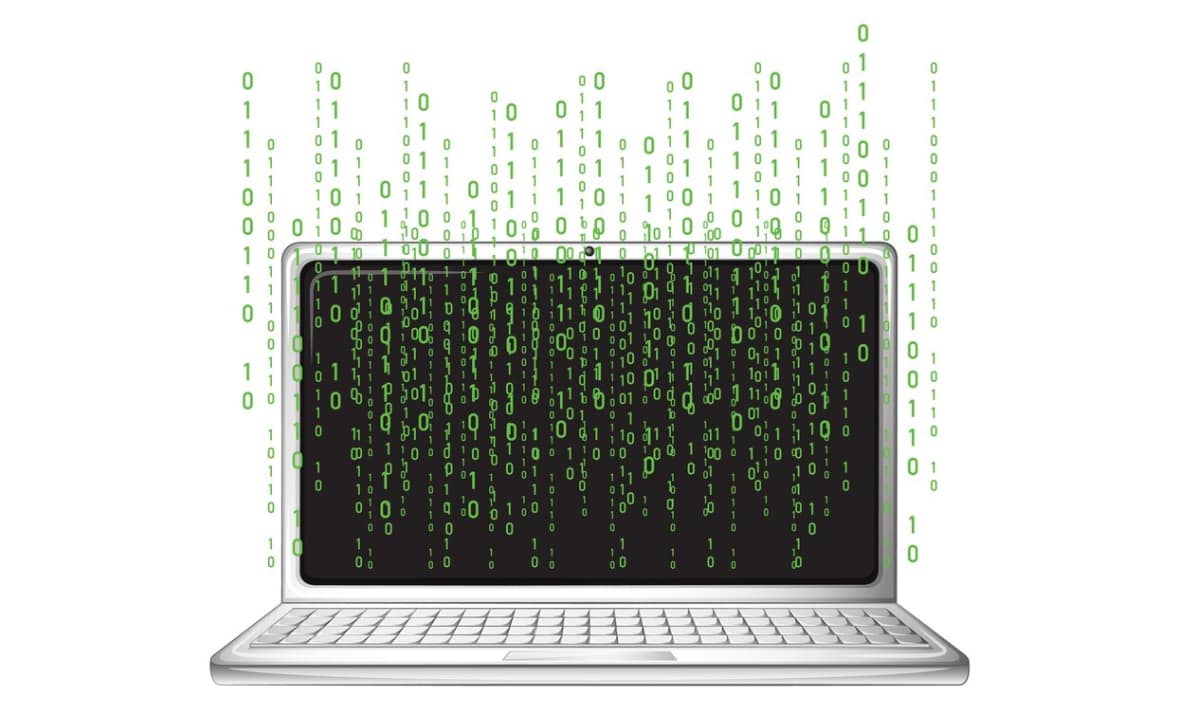 Laptop with binary code near iron plain white background