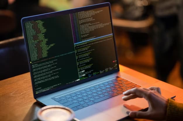 A man does programming on a laptop