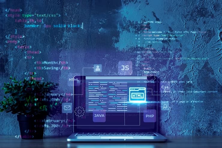 HTML Code on Laptop and Blue Background